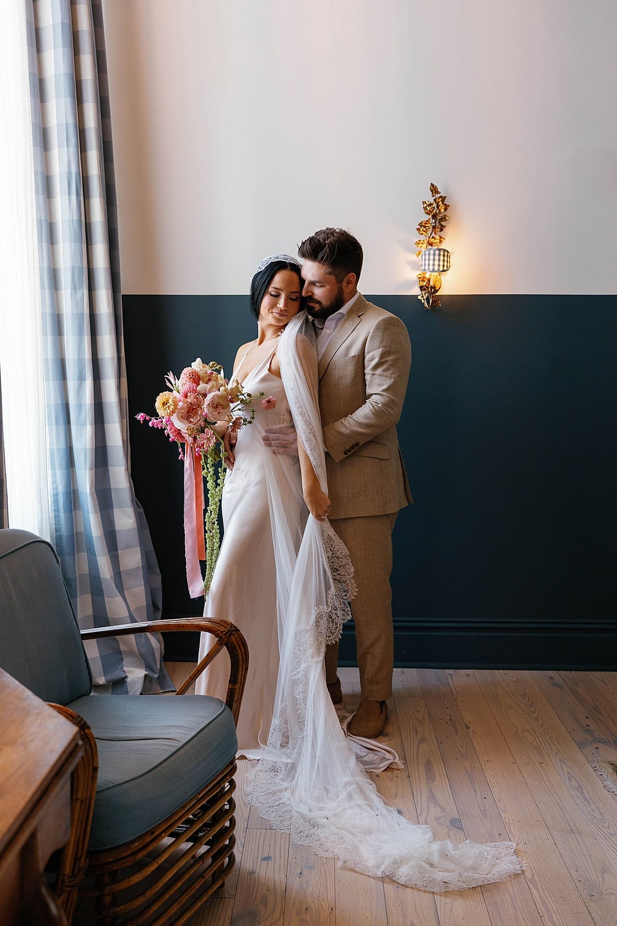 Man holds woman close before they say their vows by New Orleans wedding photographer